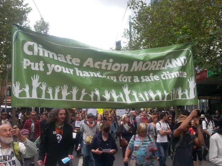 Trevor and Channa holding the banner