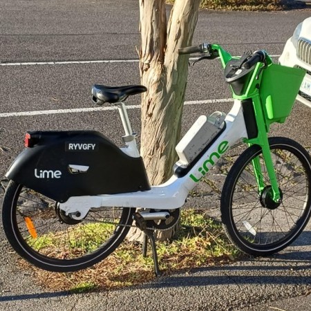 e-bike parked by tree